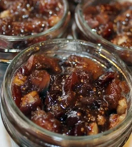 A variety of colorful chutneys in bowls, showcasing different flavors and textures.