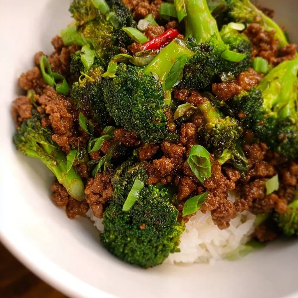 Ground beef and broccoli stir fry served in a colorful bowl