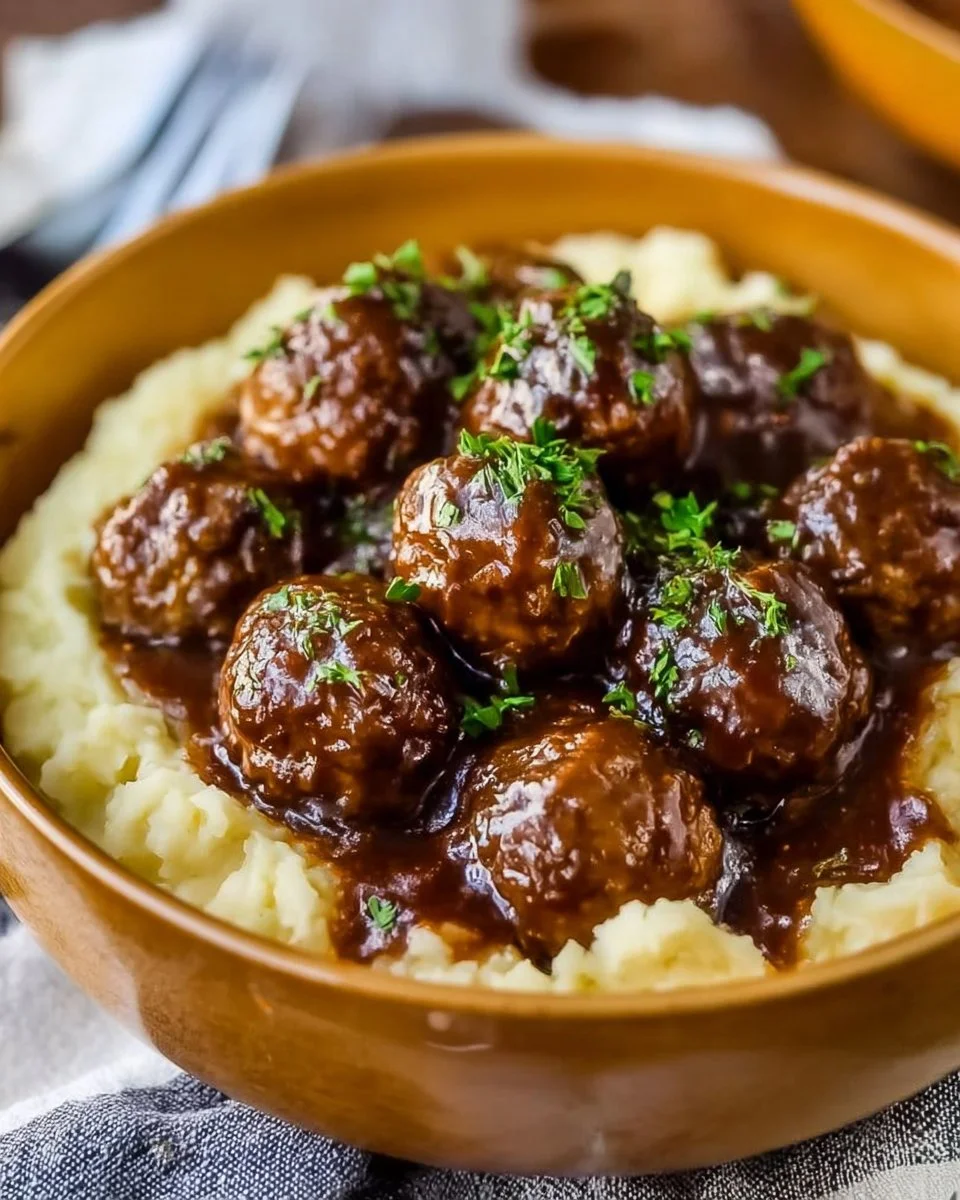 Delicious slow cooker Salisbury steak meatballs served with gravy