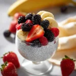 Bowl of easy Greek yogurt chia seed pudding topped with fresh berries