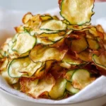 Crispy salt and vinegar zucchini chips on a plate