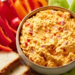 Delicious Southern pimento cheese spread served with crackers.